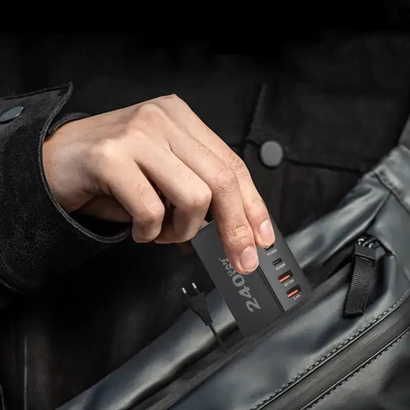 a man holding a black leather bag