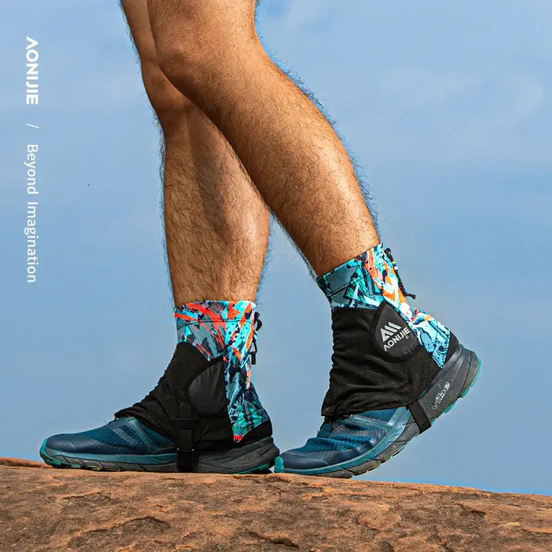 a man wearing hiking boots standing on a rock