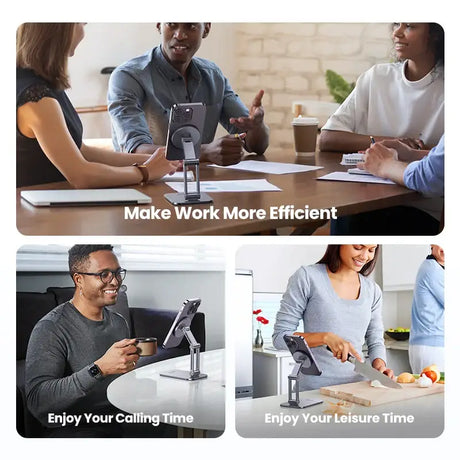 A man and woman sitting at a table with a laptop and a phone