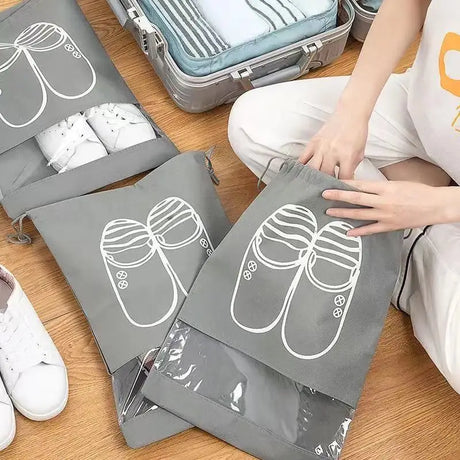 a woman sitting on the floor with her luggage