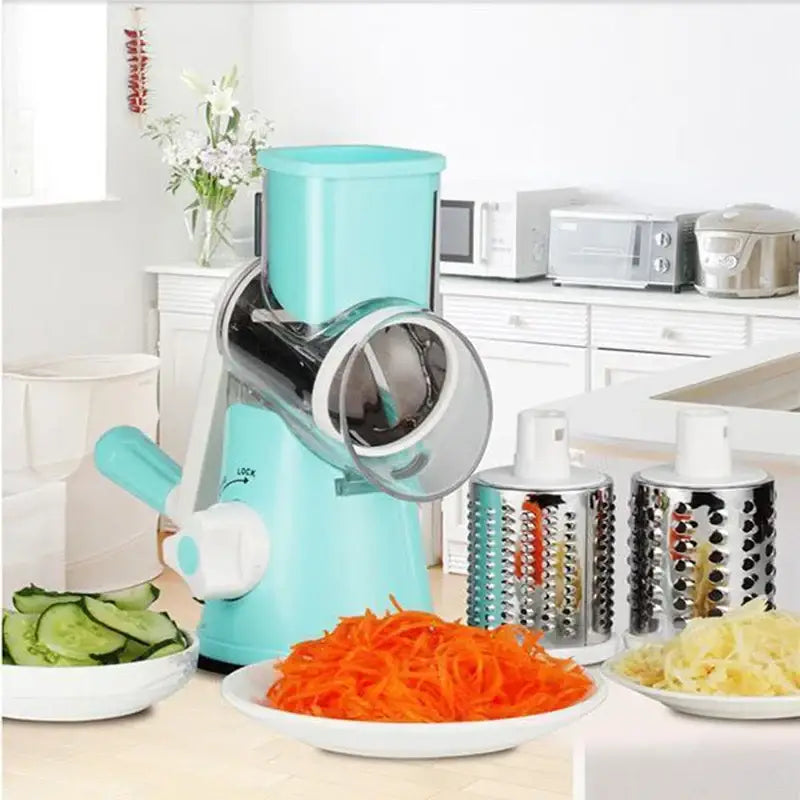 a kitchen mixer with vegetables and a bowl of carrots