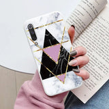 someone holding a phone case with a geometric design on it
