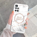 a woman holding a white marble phone case with the words enjoy women
