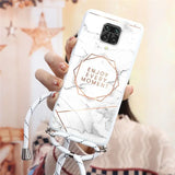 a woman holding a white marble phone case with the words enjoy me