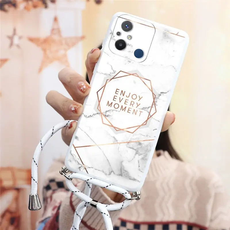 a woman holding a white marble phone case with a rose gold foil logo