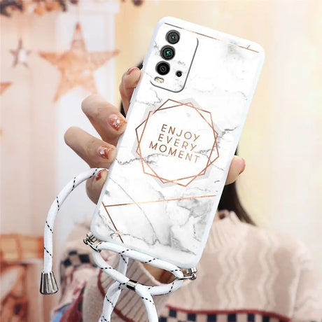 a woman holding a white marble phone case