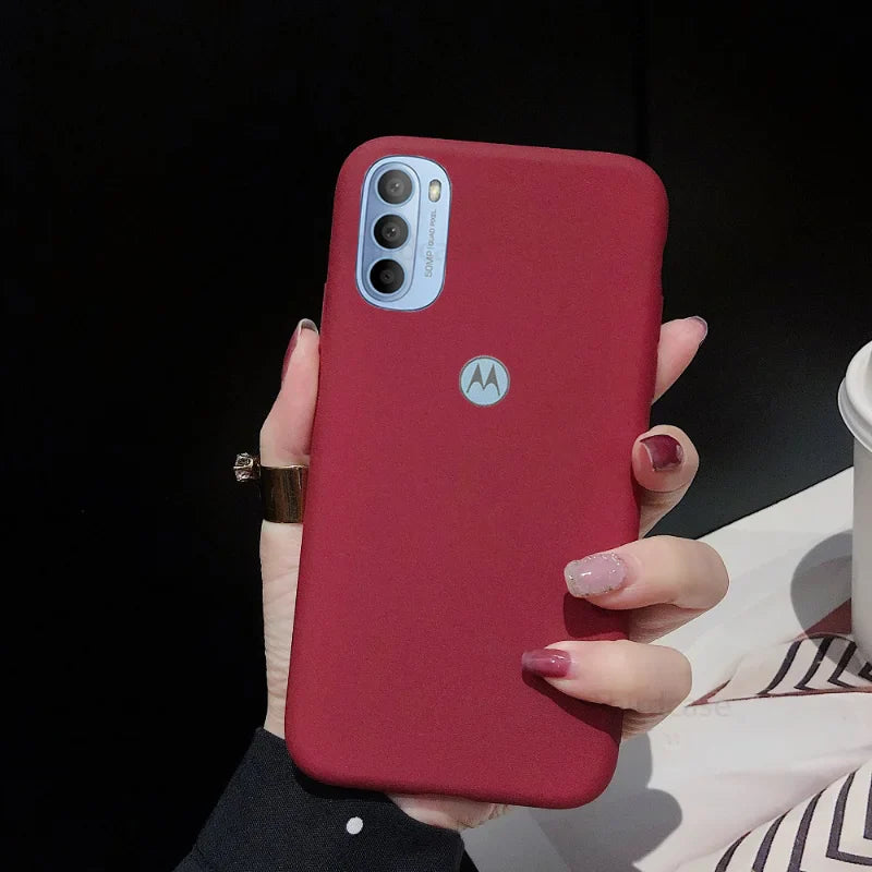 Maroon Motorola smartphone in a protective case.