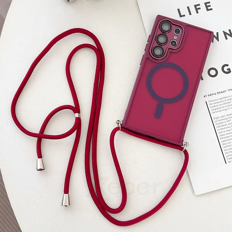 Maroon phone case with a red lanyard.