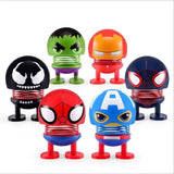 a group of six different toy figures of different colors