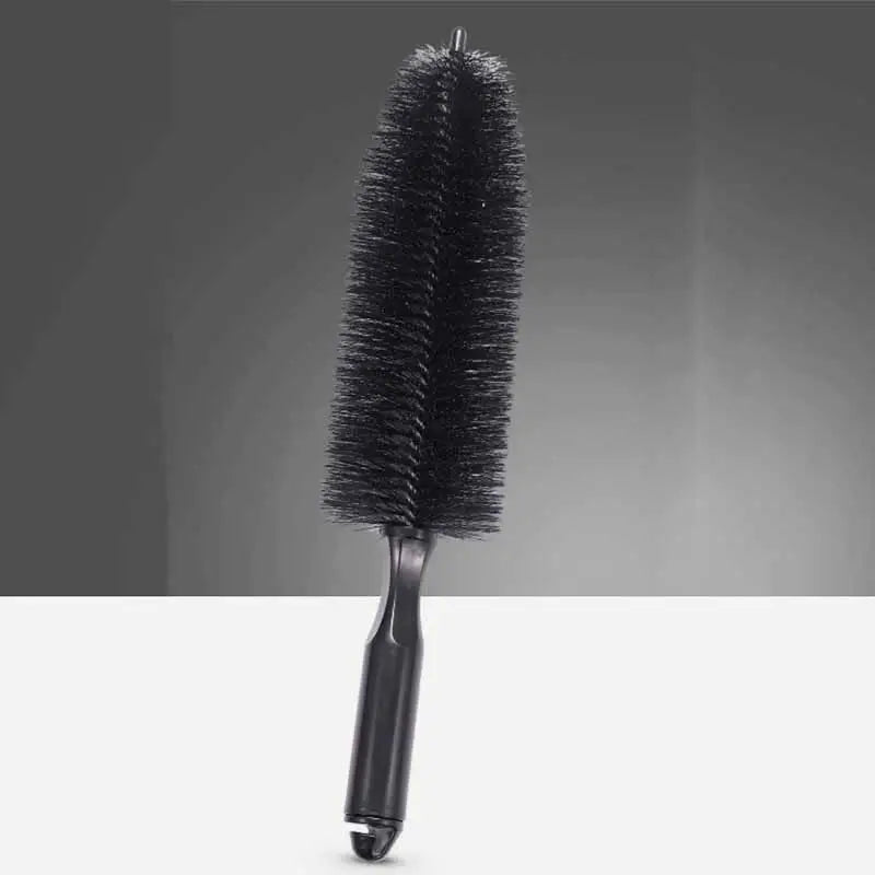 a black brush with a black handle