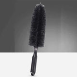 a black brush with a black handle