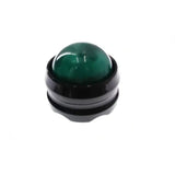 a green jade stone in a black ceramic ring