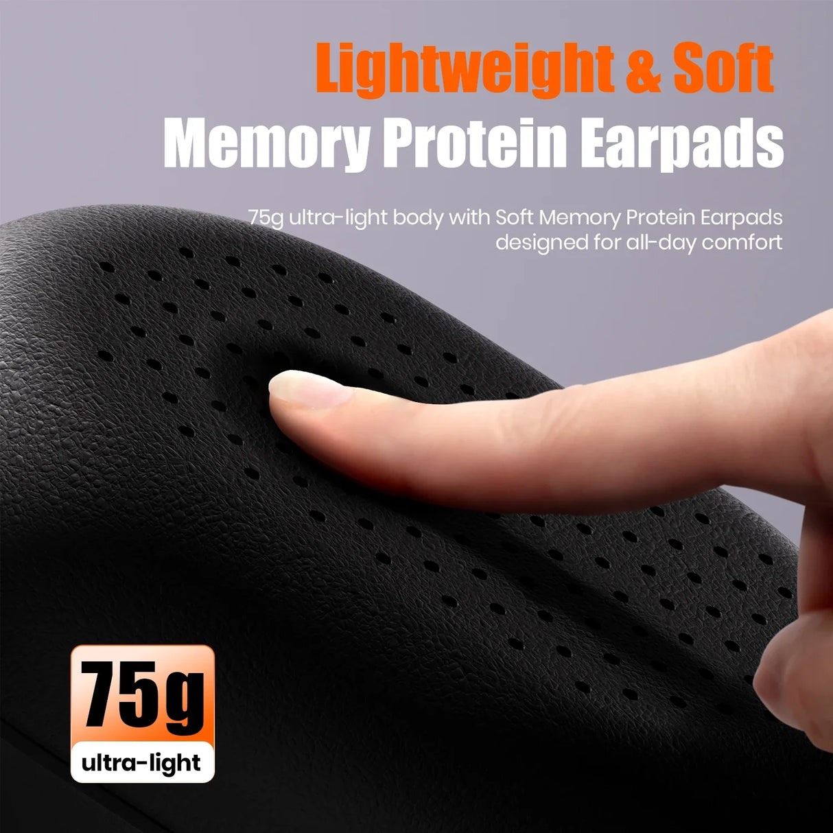 Memory foam earpads with perforated surface being pressed by a finger to demonstrate softness.