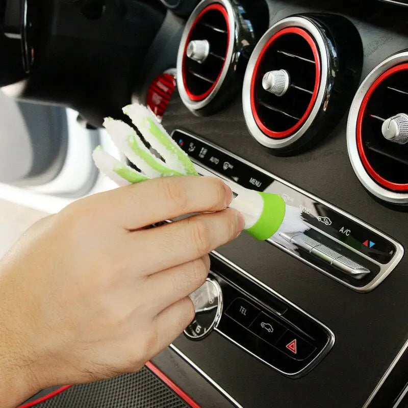 a man cleaning the interior of a car