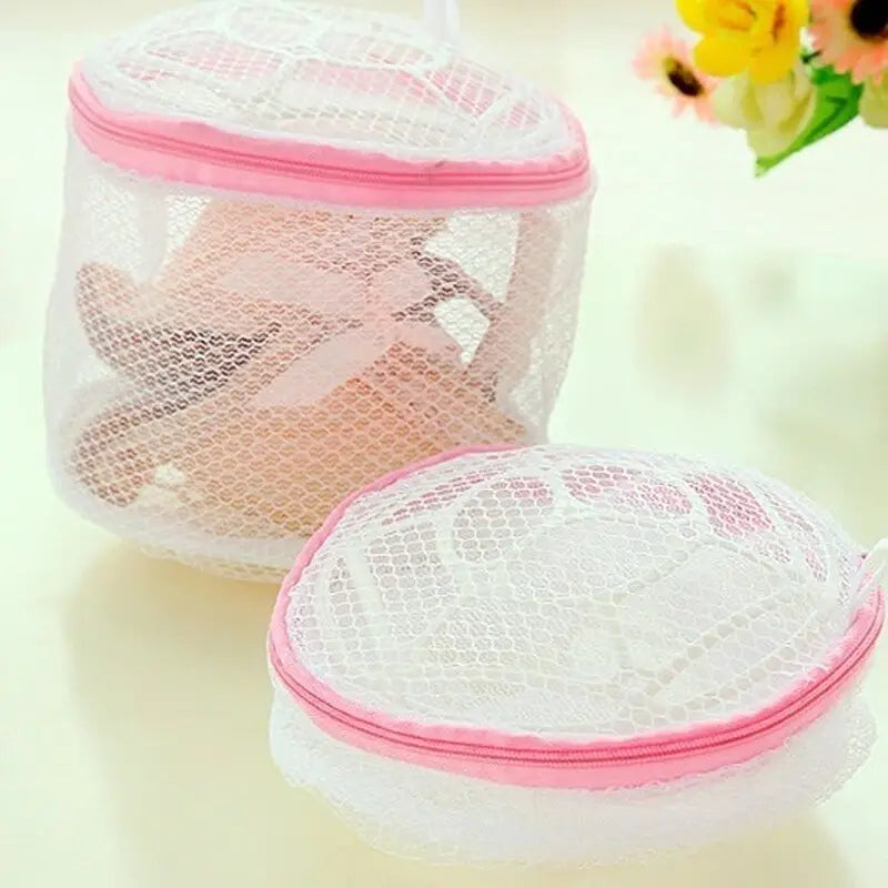 two small mesh bags with pink handles