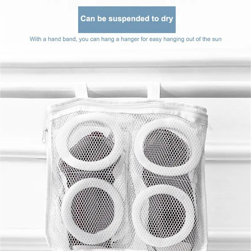 a white mesh bag with four mesh bags inside