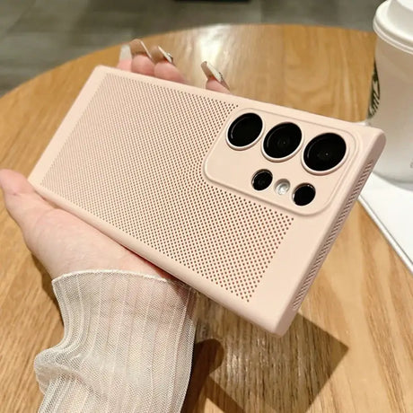 a person holding a pink iphone case