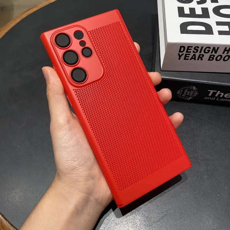 a hand holding a red iphone case