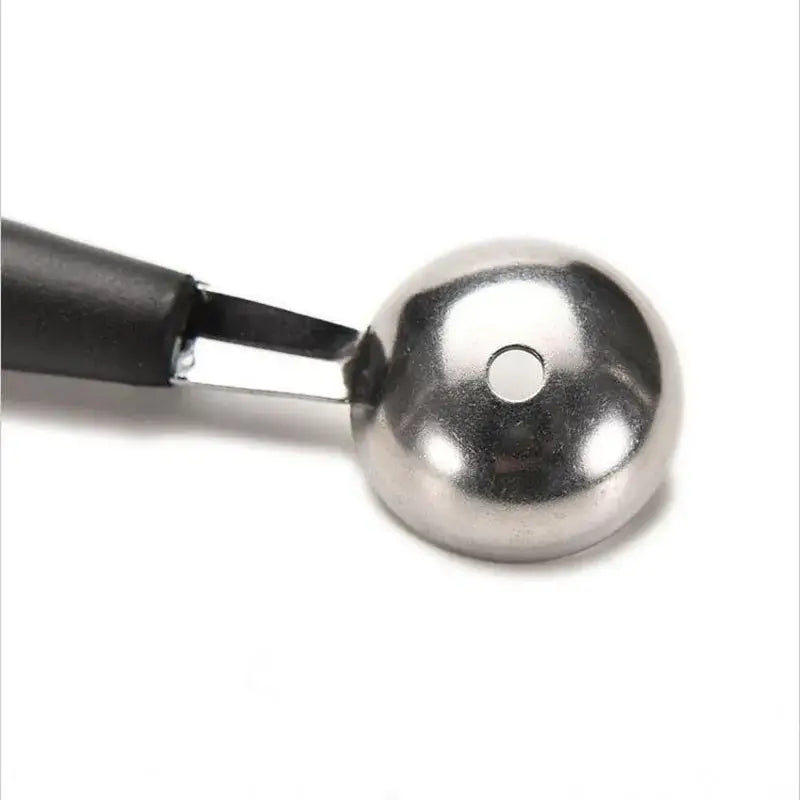 a metal ball with a black handle