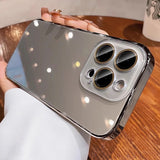 A metallic silver reflective phone case with three prominent camera cutouts and a clear lens protector.