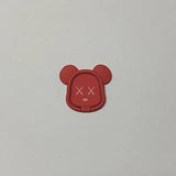a red mickey mouse head with a white background