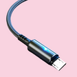 Micro USB cable with a metallic connector and blue braided cord.