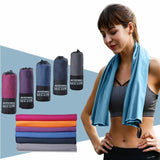 a woman wearing a scarf and a yoga mat