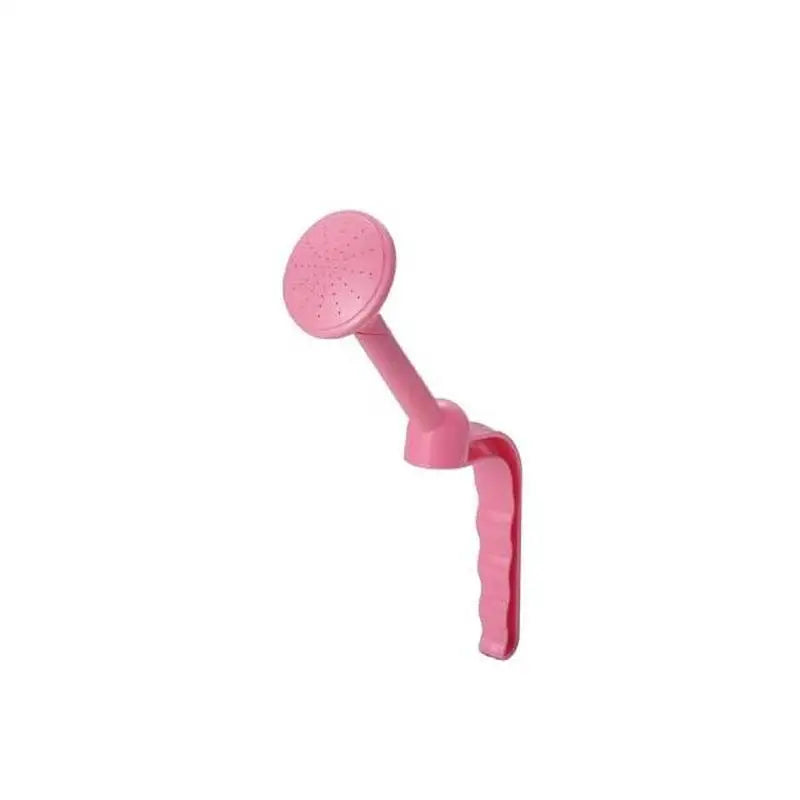 a pink plastic toy with a handle