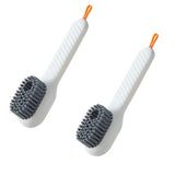 two tooth brushes with orange handles