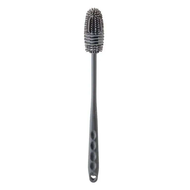 a close up of a toothbrush with a black bristles on it