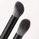 two brushes on a white background