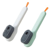 two toothbrushs with a toothbrush on top