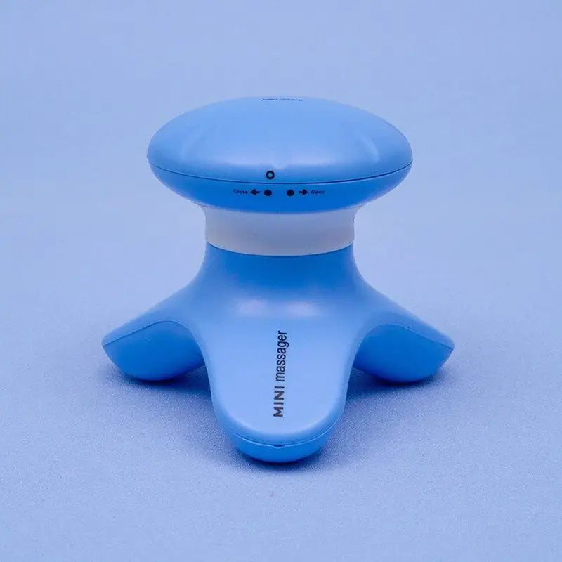 a blue and white plastic toy with a small white button