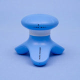 a blue and white plastic toy with a small white button