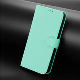 Mint green faux leather phone case with a magnetic clasp.