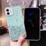 Mint green glittery phone case with dual camera cutouts for an iPhone.