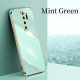 the mint green iphone case is shown on a table
