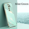 the mint green iphone case is shown on a table