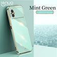 the mint green iphone case is shown on a table
