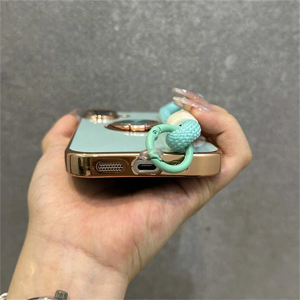 Mint green phone case with beaded strap.