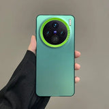 Mint green smartphone with a distinctive circular camera module featuring a neon green accent ring.