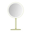 a mirror on a stand with a light green base