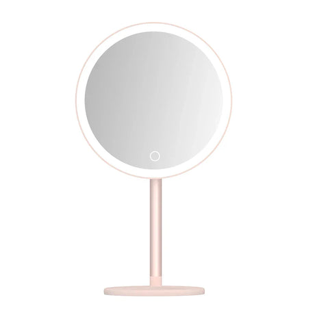 the mirror is on a stand with a white background