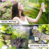 a woman spraying water on plants