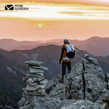 a man standing on top of a mountain