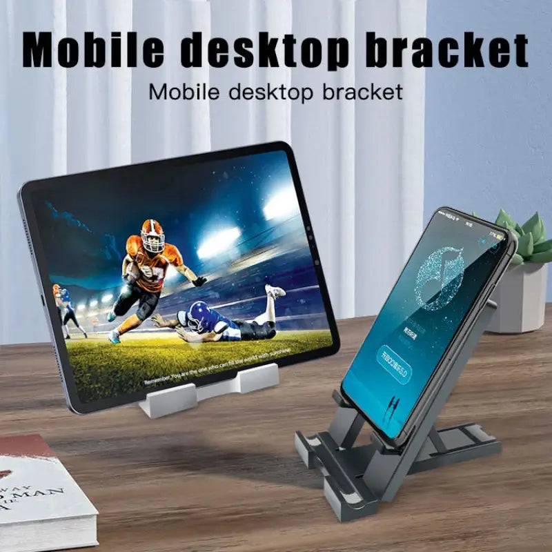 there is a cell phone and a desktop computer on a desk