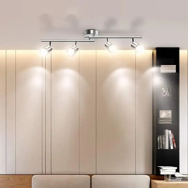 a modern bedroom with a bed and a wall mounted light
