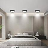 A modern bedroom with a large bed and a large window
