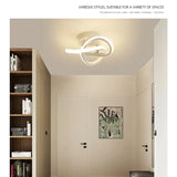 a white light fixture on a wall