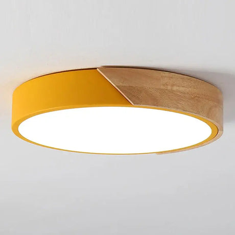 a yellow ceiling light with a circular light fixture